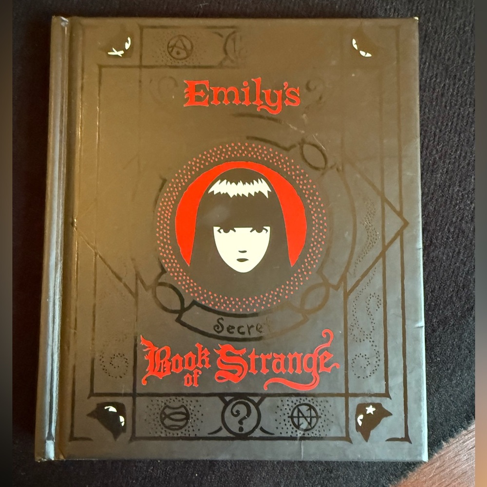 Emily's Secret Book Of Strange